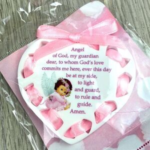 Plexiglass baby heart shaped crib plaque.  Pink